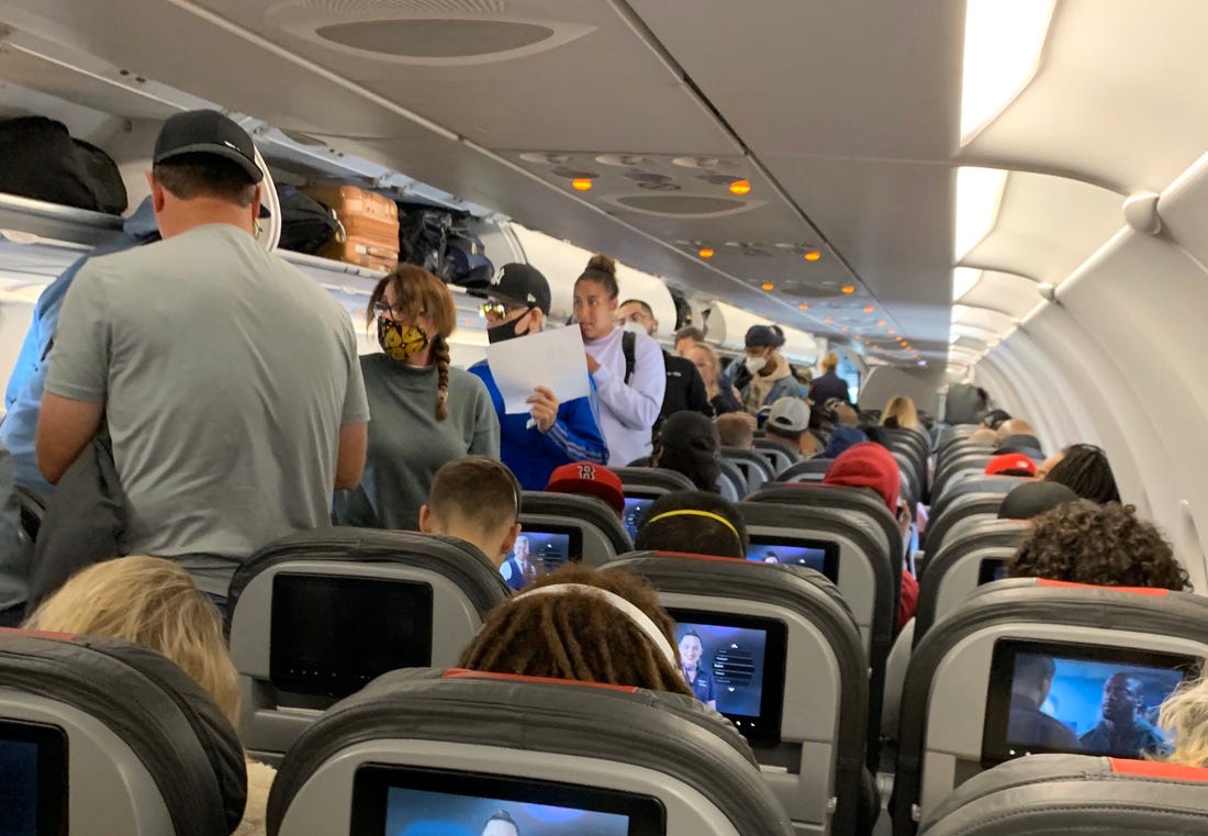 Crowded Aircraft Aisle during Boarding